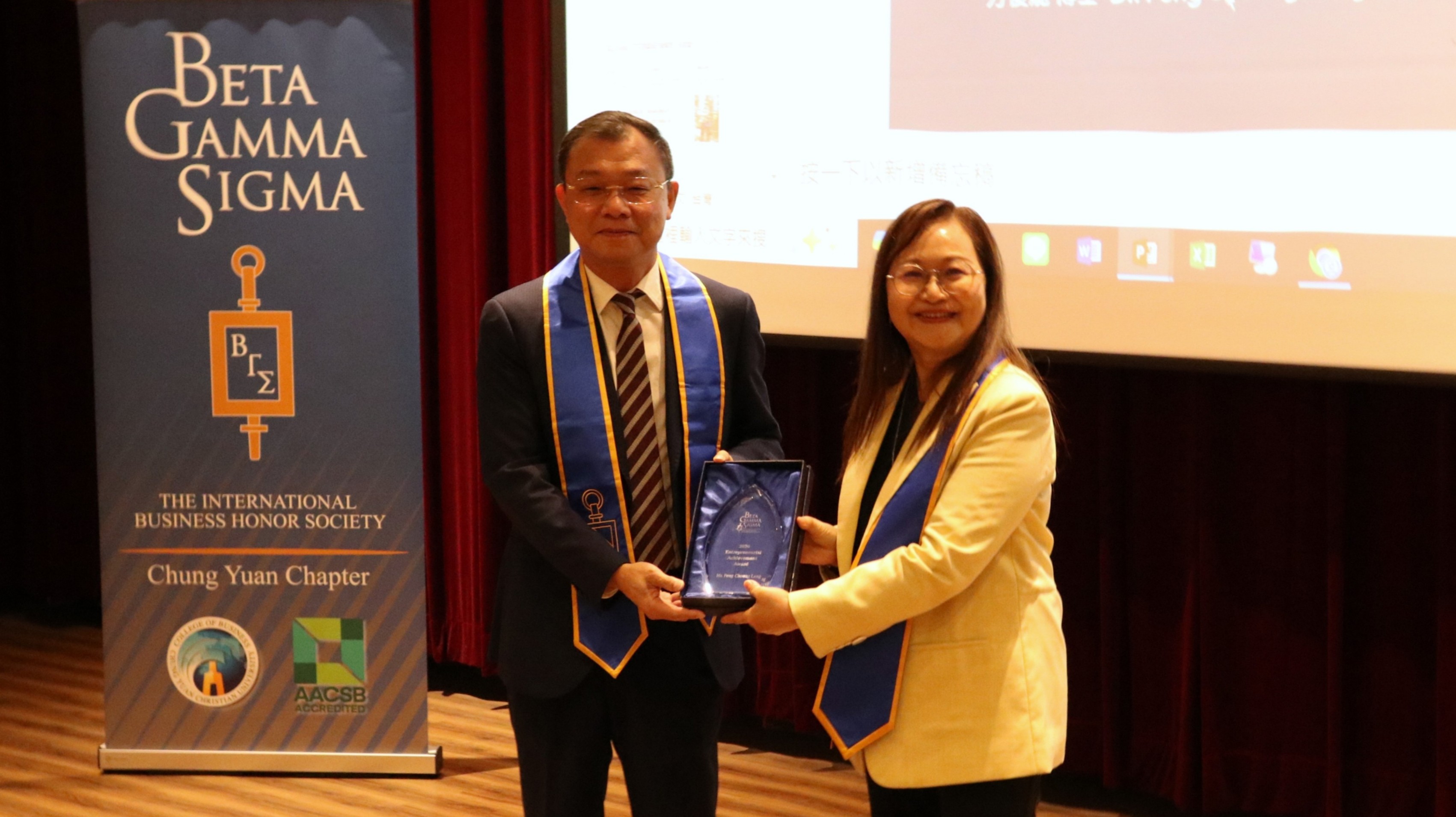 Dean Ming-Lei Chang of the CYCU College of Business presents the BGS award plaques on behalf of the BGS Global Headquarters.